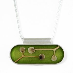 Oval pendant: stems and seeds on pea green